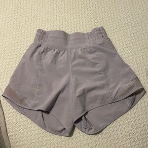 Only worn a couple times 4 inch high-rise size 2 purple Lululemon shorts